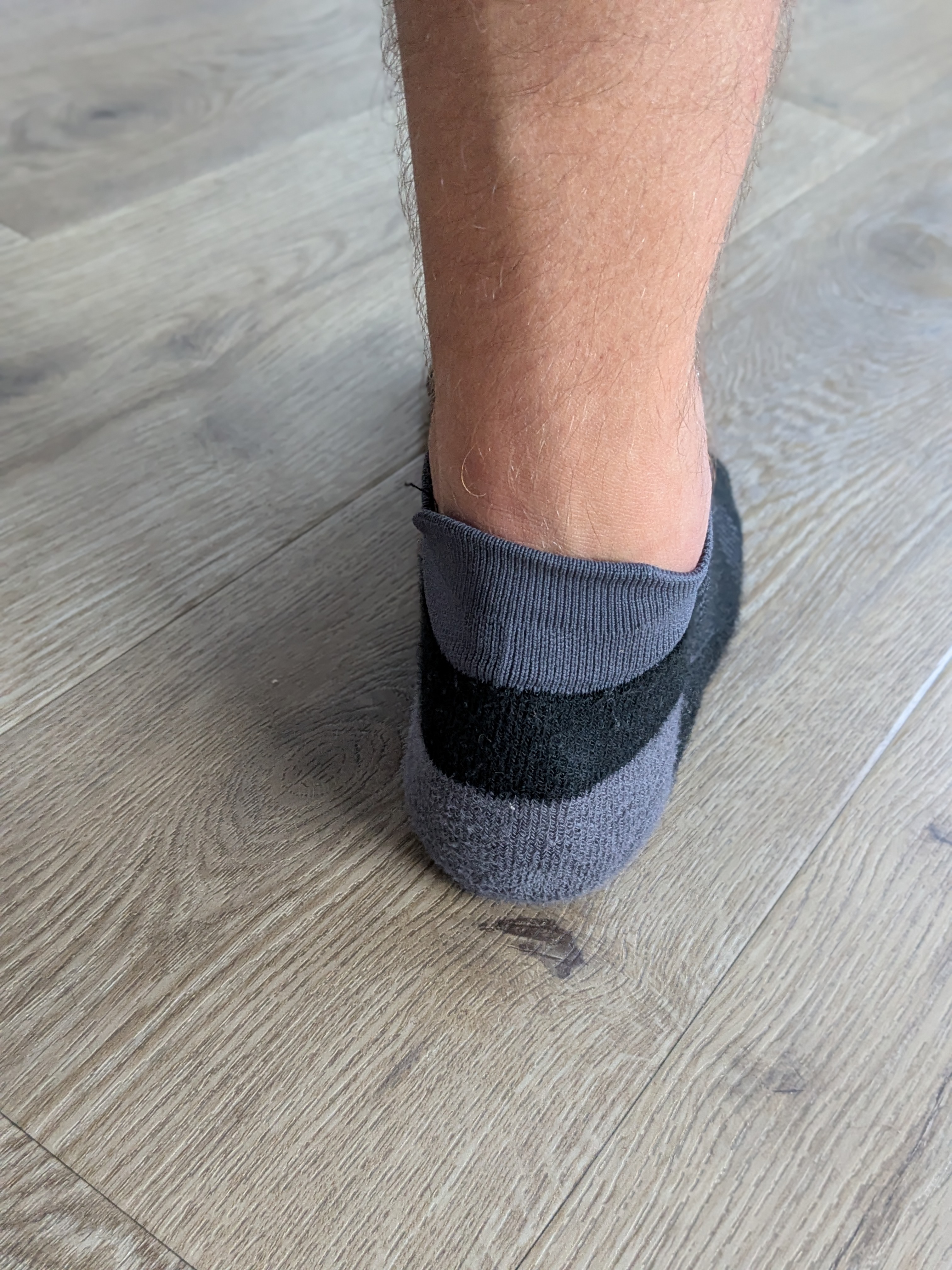Injinji Run Lightweight No-Show Wool heel tab — the small tab that prevents the sock sliding into the shoe