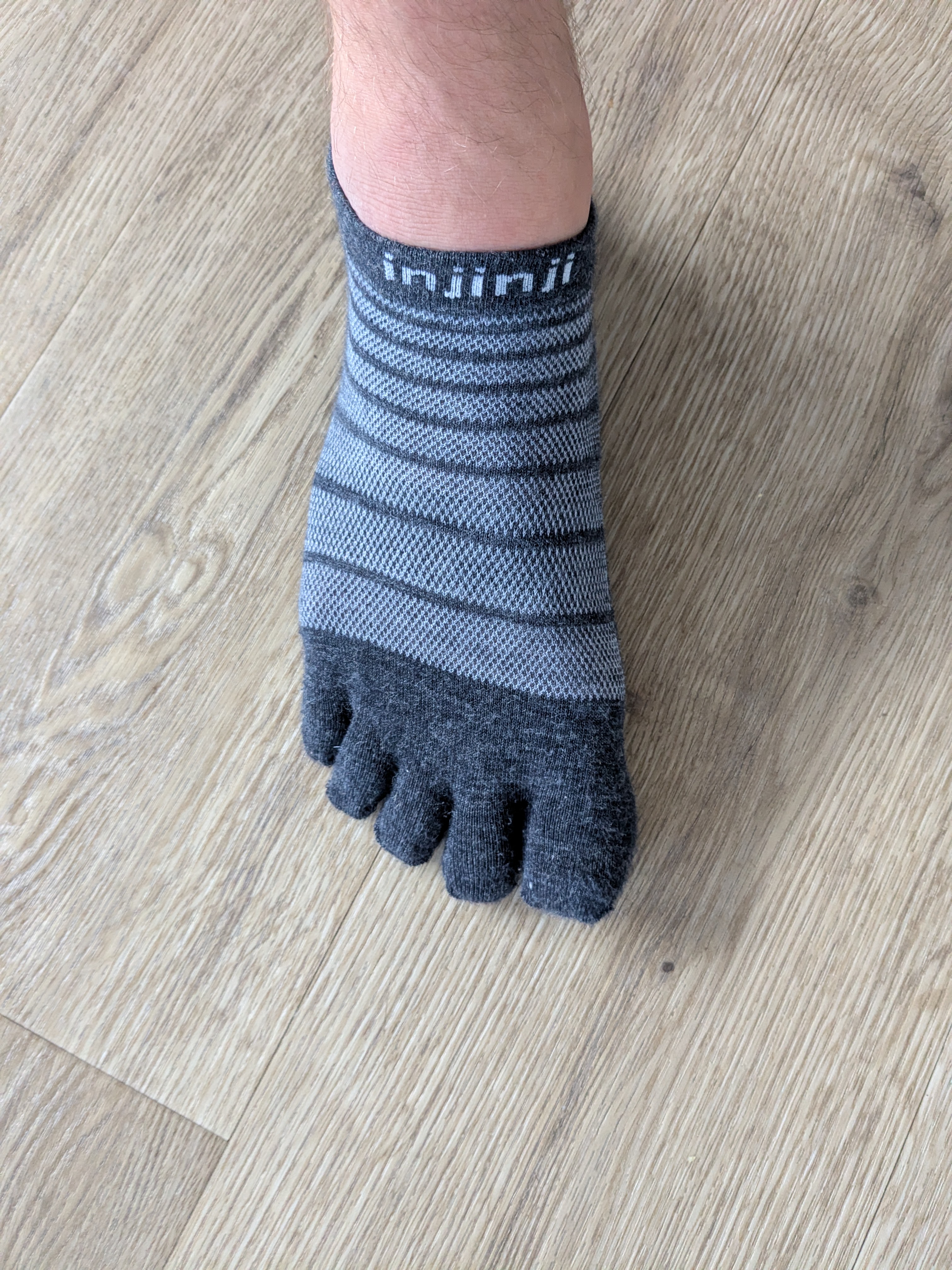 Injinji Run Lightweight No-Show Wool — grey merino variant on foot from the front